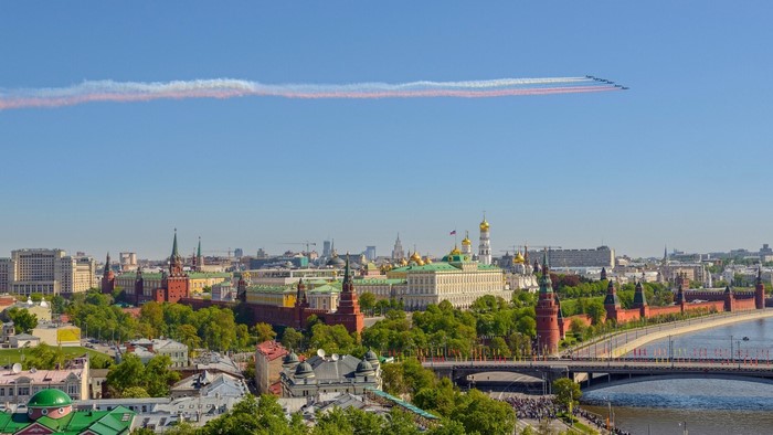 Moscow Kremlin and Airplanes with Smoke Trails