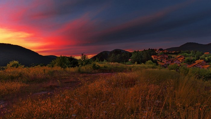 Sunset over a village in the mountains