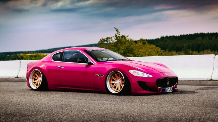 Pink Maserati GranTurismo S on a road