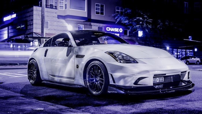 White Nissan 350Z parked at night