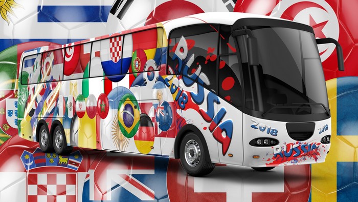 Bus decorated with national flags and 'Russia 2018' text