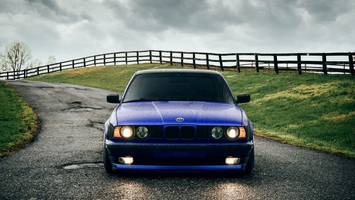 Blue BMW on a Country Road