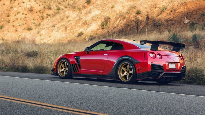 Red Nissan GT-R with Gold Wheels on Road