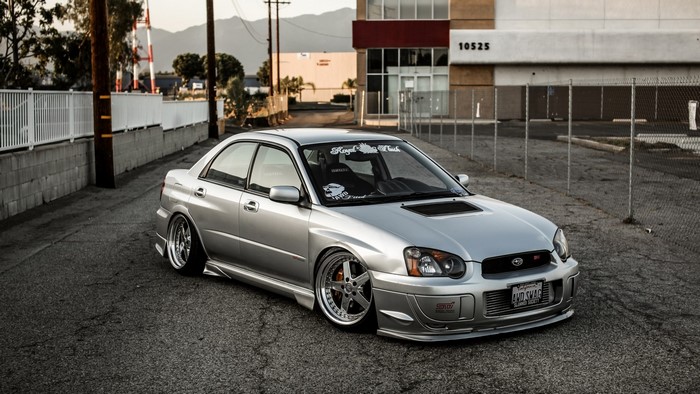 Silver Subaru Impreza STI parked on asphalt
