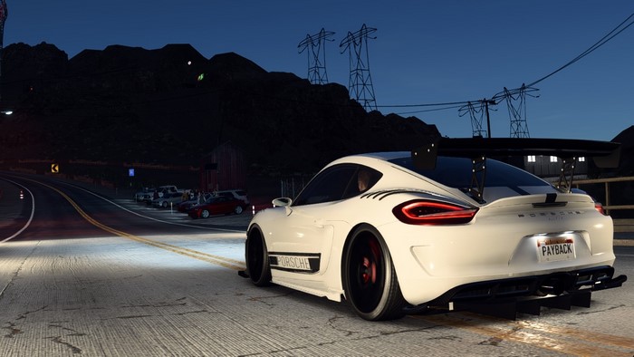 White Porsche Cayman GT4 on a Road at Night