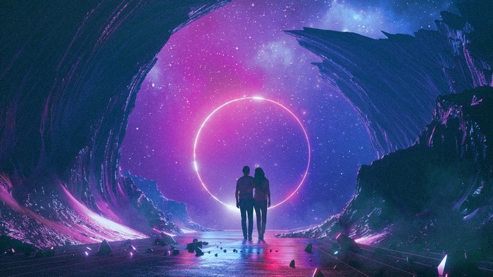Couple walking towards a glowing ring in a cosmic cave