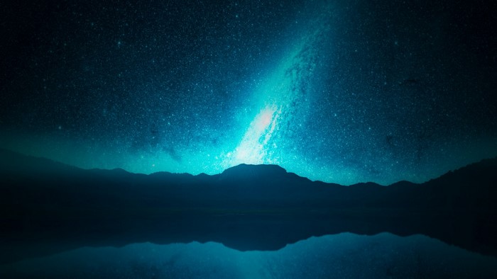 Starry Milky Way over Mountains and Lake