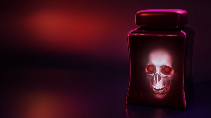 Skull inside a dark bottle with red eyes