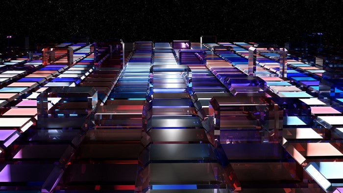Abstract glass structures with colorful lights against starry sky