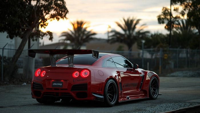Red Nissan GT R with large spoiler