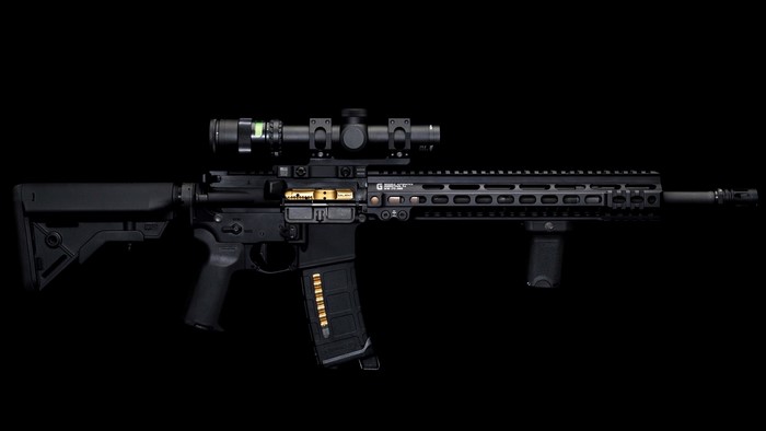 AR-15 rifle with scope and magazine