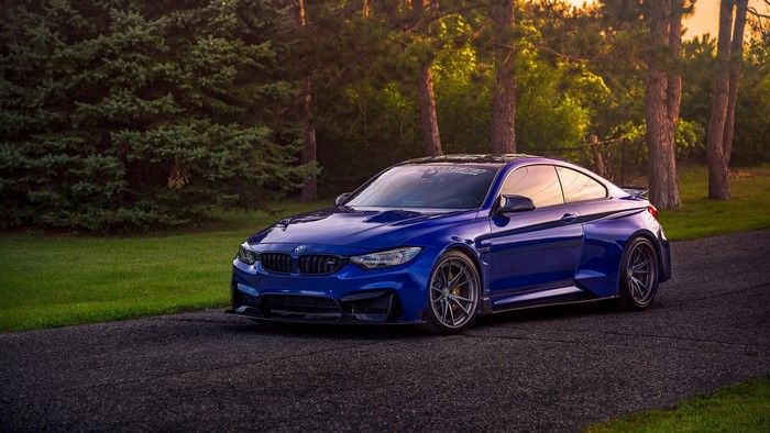 Blue BMW M4 Coupe on a Road