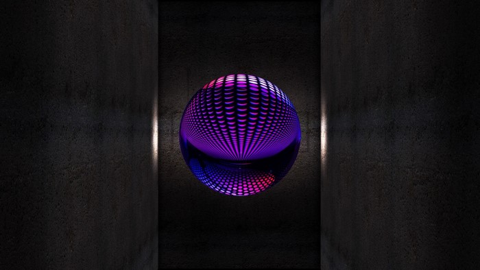 Purple and pink patterned sphere in a dark corridor