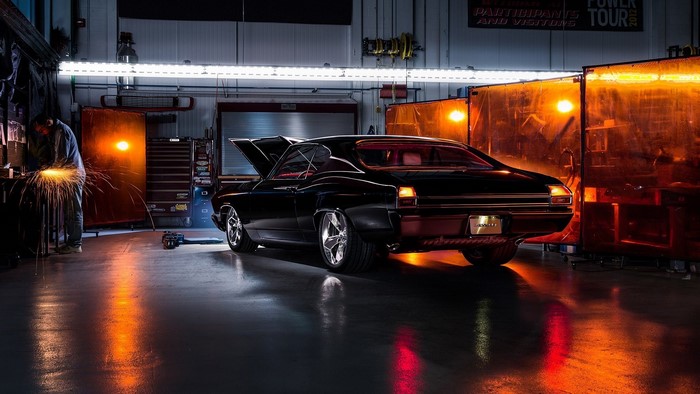Black Chevrolet Chevelle in a workshop