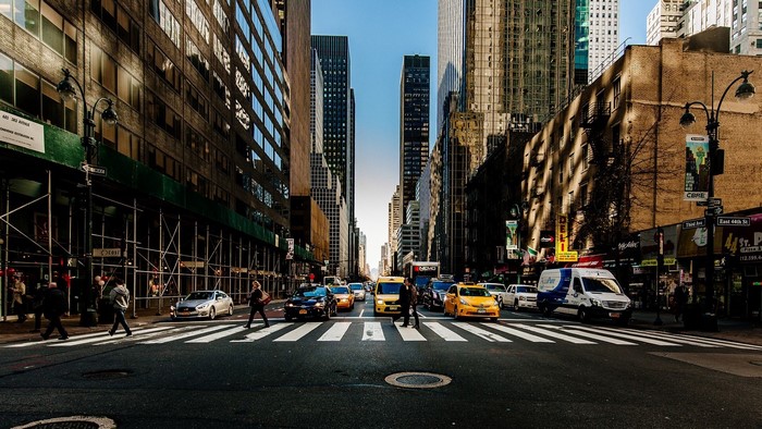New York City street with skyscrapers and traffic