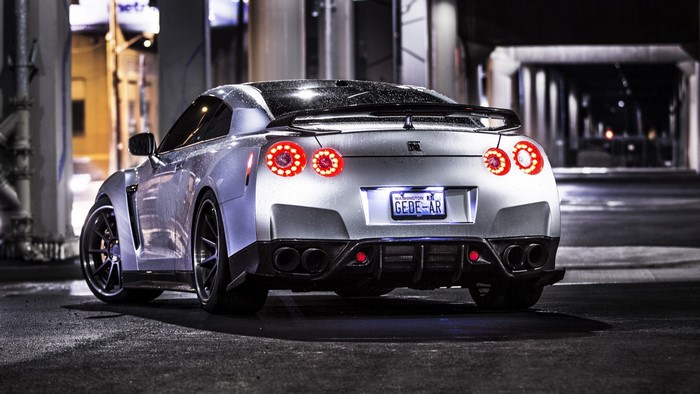 Nissan GT-R parked in an urban alley at night