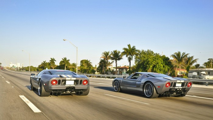 Two Ford GT cars driving on a highway