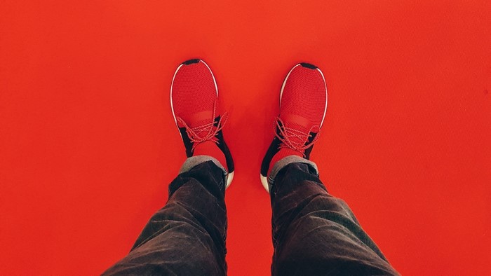 Red Adidas Sneakers on Red Background