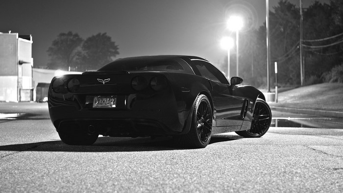 Black Chevrolet Corvette parked at night