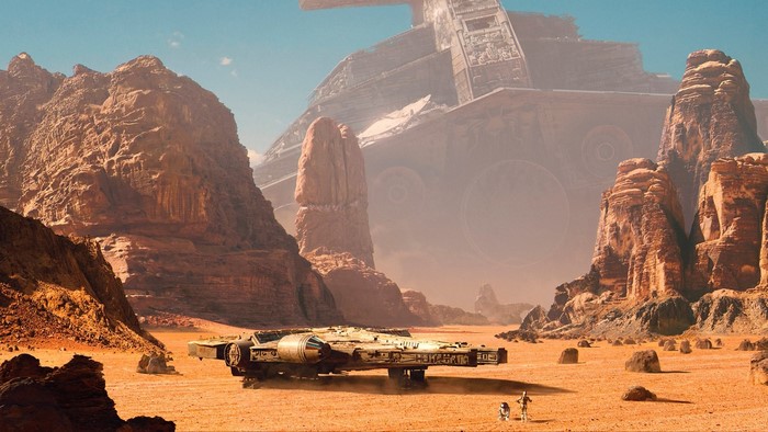 Millennium Falcon and droids on desert planet with Star Destroyer