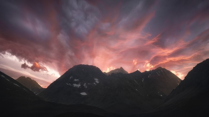 Mountains under a dramatic sunset sky