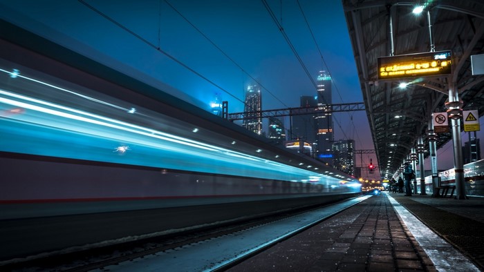 Train speeding through Moscow at night