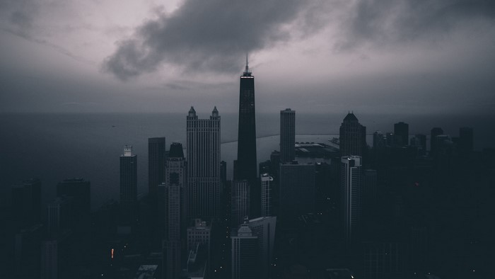 Cityscape with tall buildings and cloudy sky