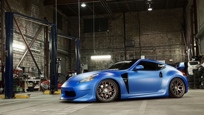 Blue Nissan 370Z in a garage