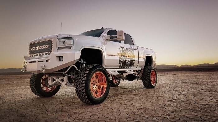 White GMC Sierra Denali 2500 HD lifted truck