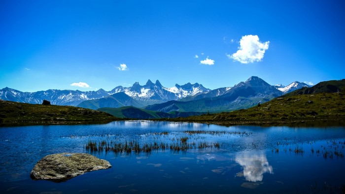 Mountain Landscape with Lake and Snow-Capped Peaks