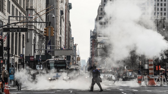 New York City street with steam and traffic