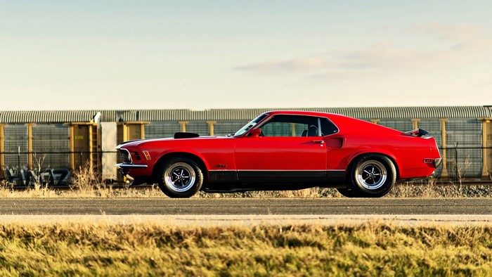 Red 1970 Ford Mustang Mach 1 parked