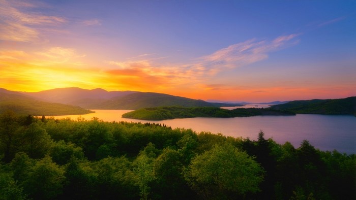 Sunset over a lake and mountains
