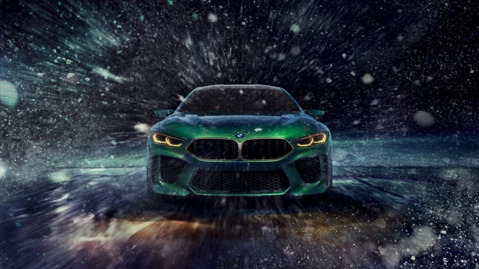 Green BMW M8 in snow