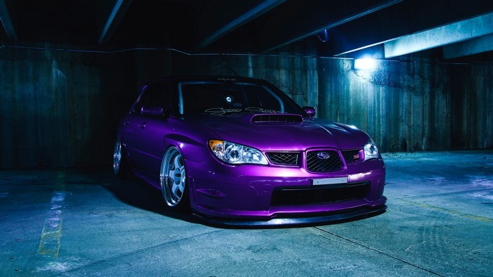 Purple Subaru Impreza STI in parking garage