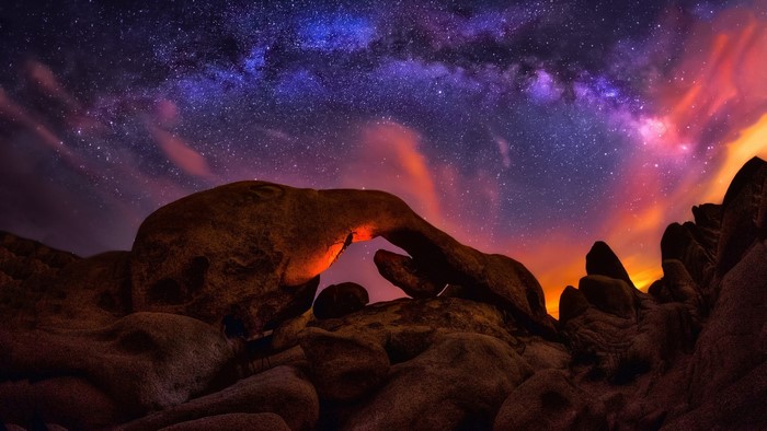 Milky Way over rock arch at sunset