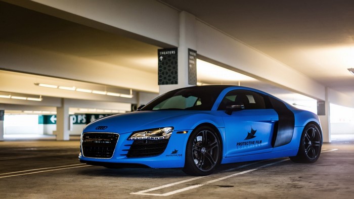Blue Audi R8 in a parking garage