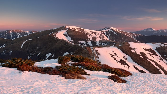 Mountains with snow at sunset