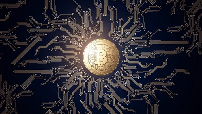 Bitcoin coin on a circuit board