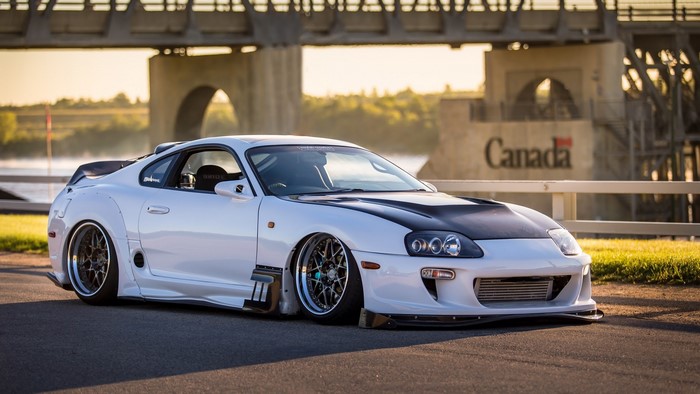 White Toyota Supra with custom body kit