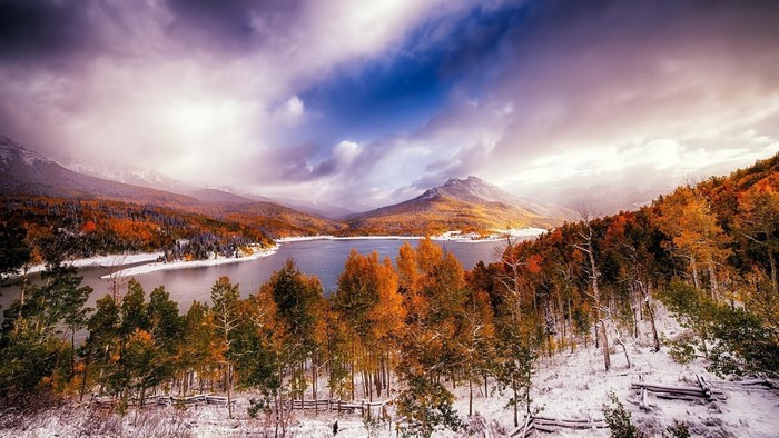 Autumn lake with snow and mountains