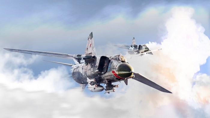 Two Soviet MiG-23 fighter jets flying through clouds