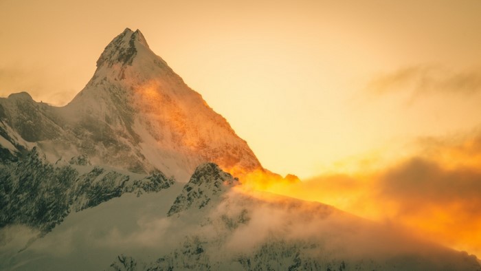 Snowy Mountain Peak at Sunset