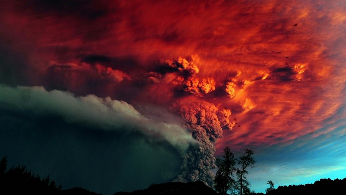 Volcanic eruption with red clouds