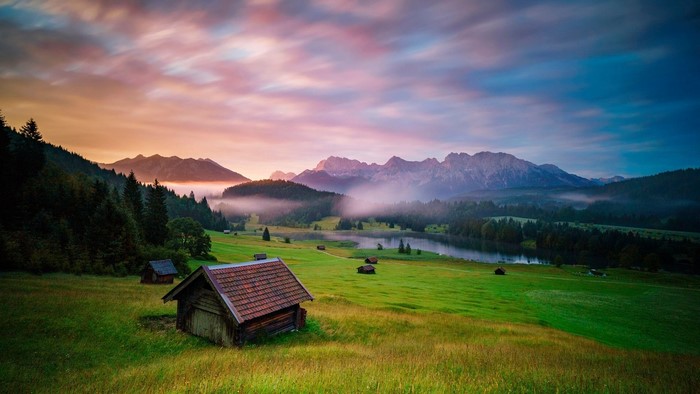 Bavarian Alps landscape with cabins at sunrise
