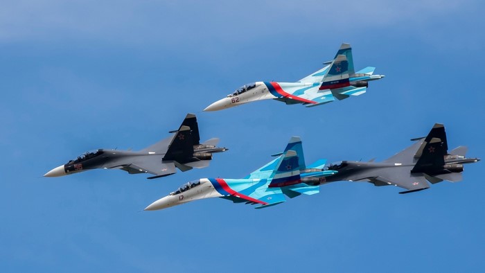 Four Sukhoi fighter jets flying in formation