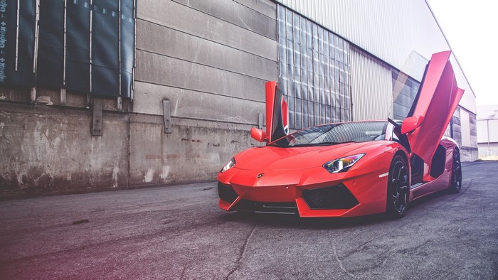 Red Lamborghini Aventador LP 700-4 with doors open