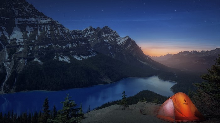 Tent overlooking lake and mountains in Alberta, Canada