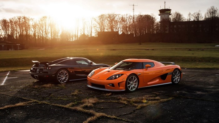 Two Koenigsegg CCXR cars on tarmac
