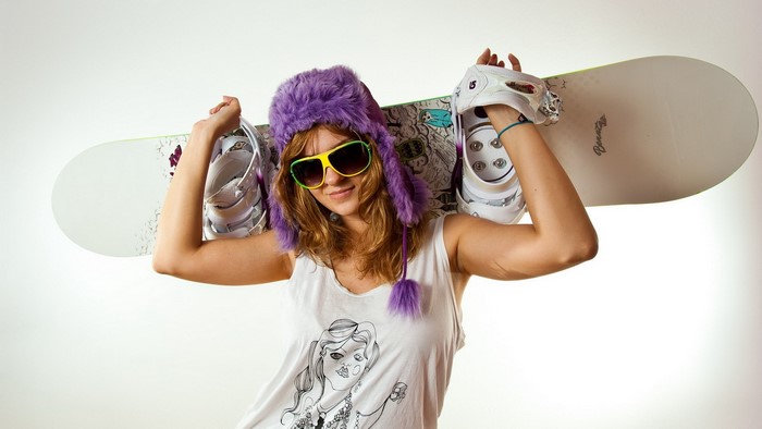 Girl with snowboard and boots